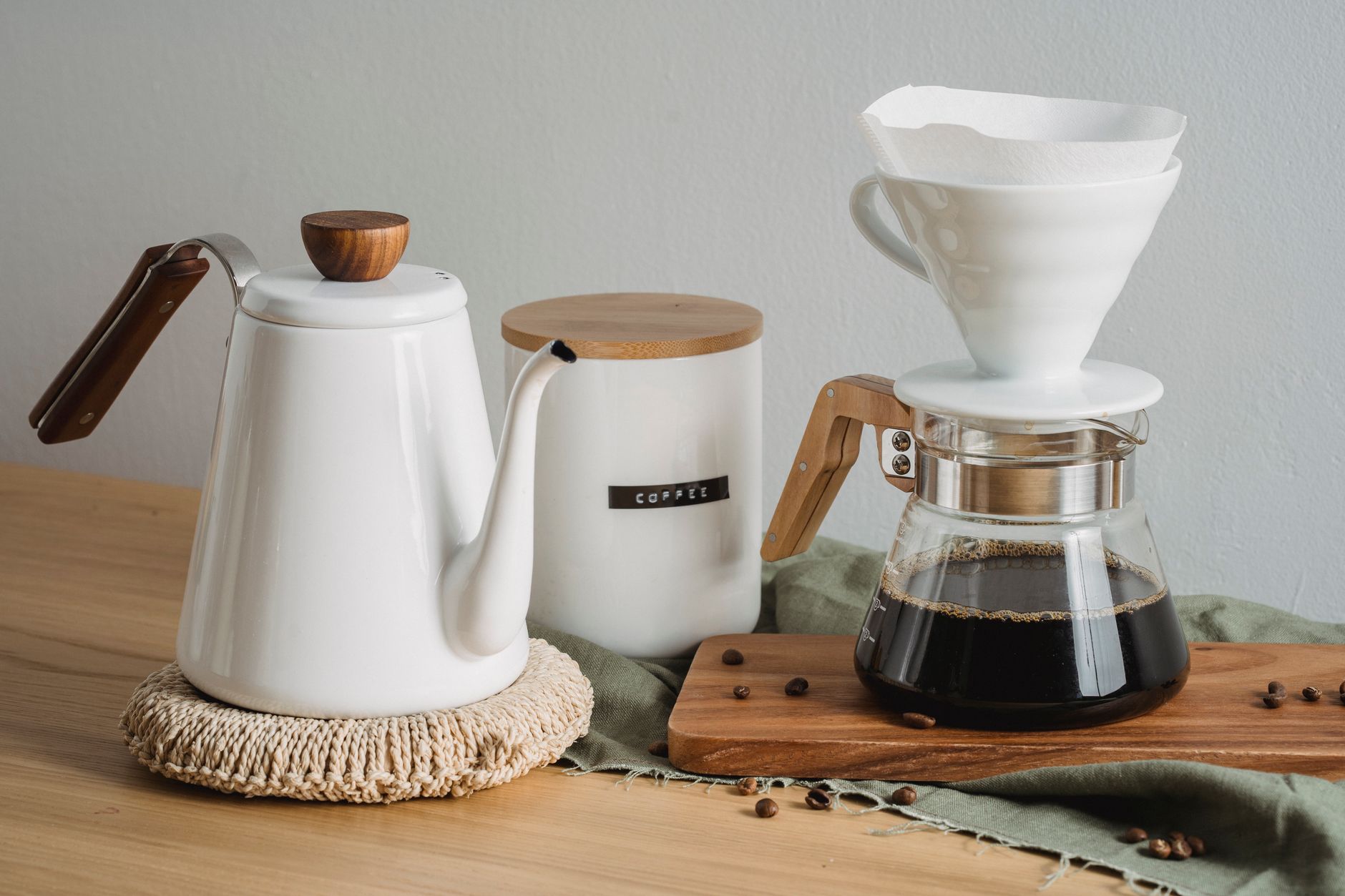 hario v60 ceramic dripper on wooden stand with coffee