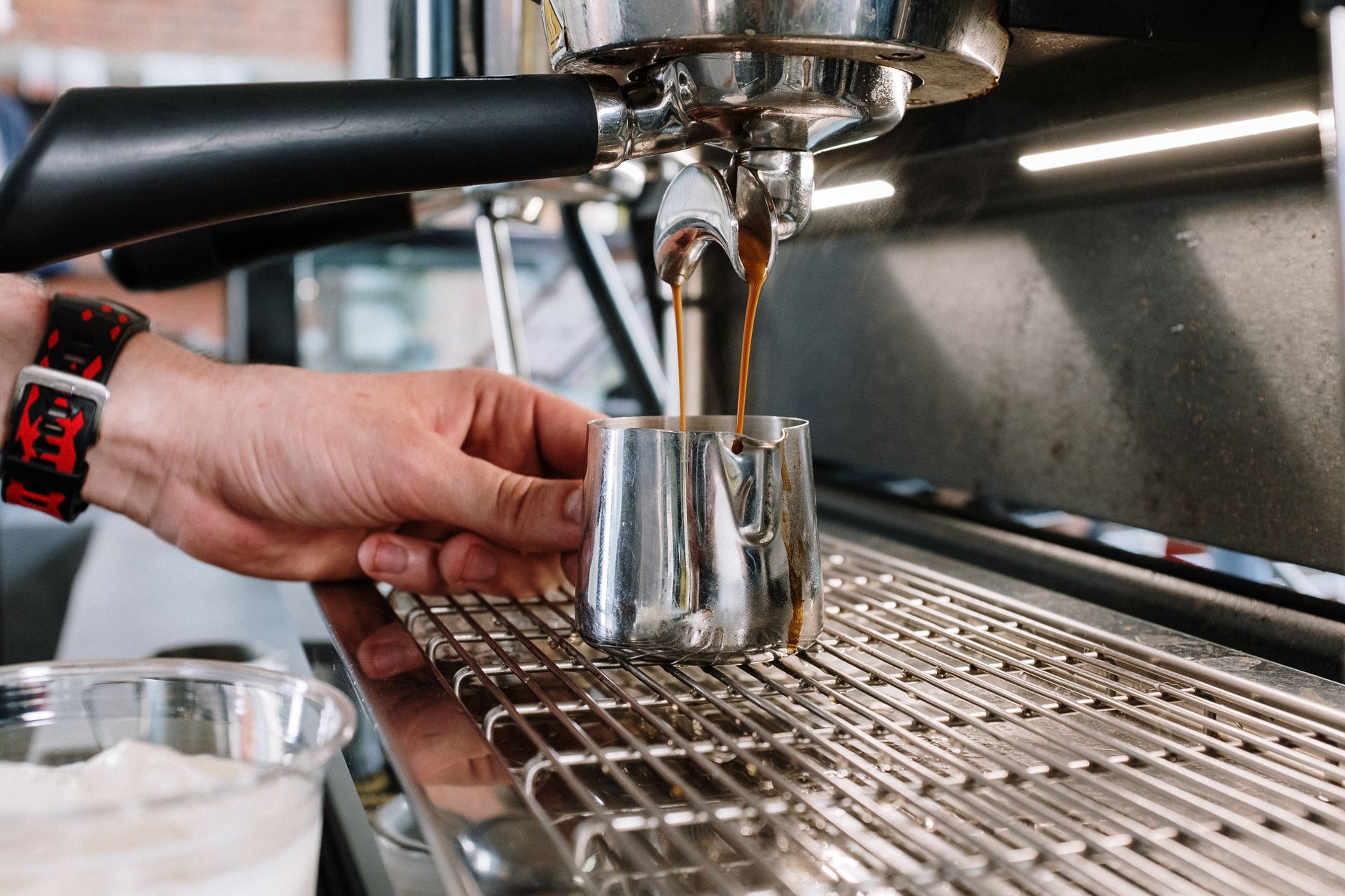 gooseneck kettle spout pouring over dripper