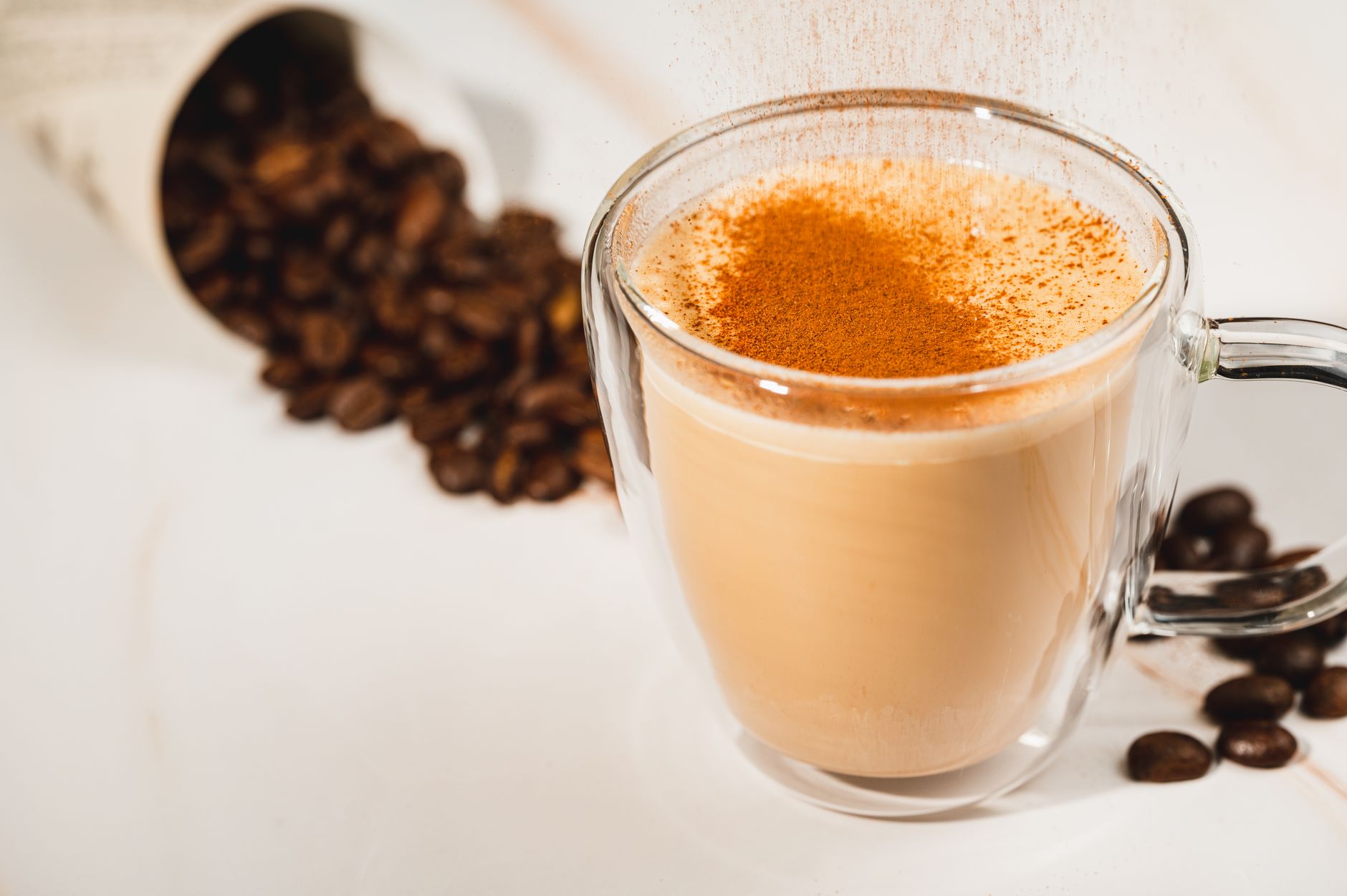 oat milk pouring over iced espresso brown sugar drink