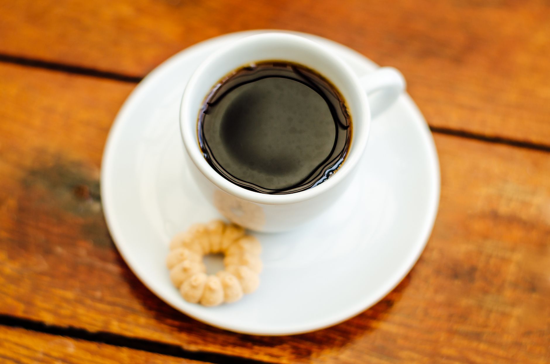 espresso shot golden crema in demitasse cup