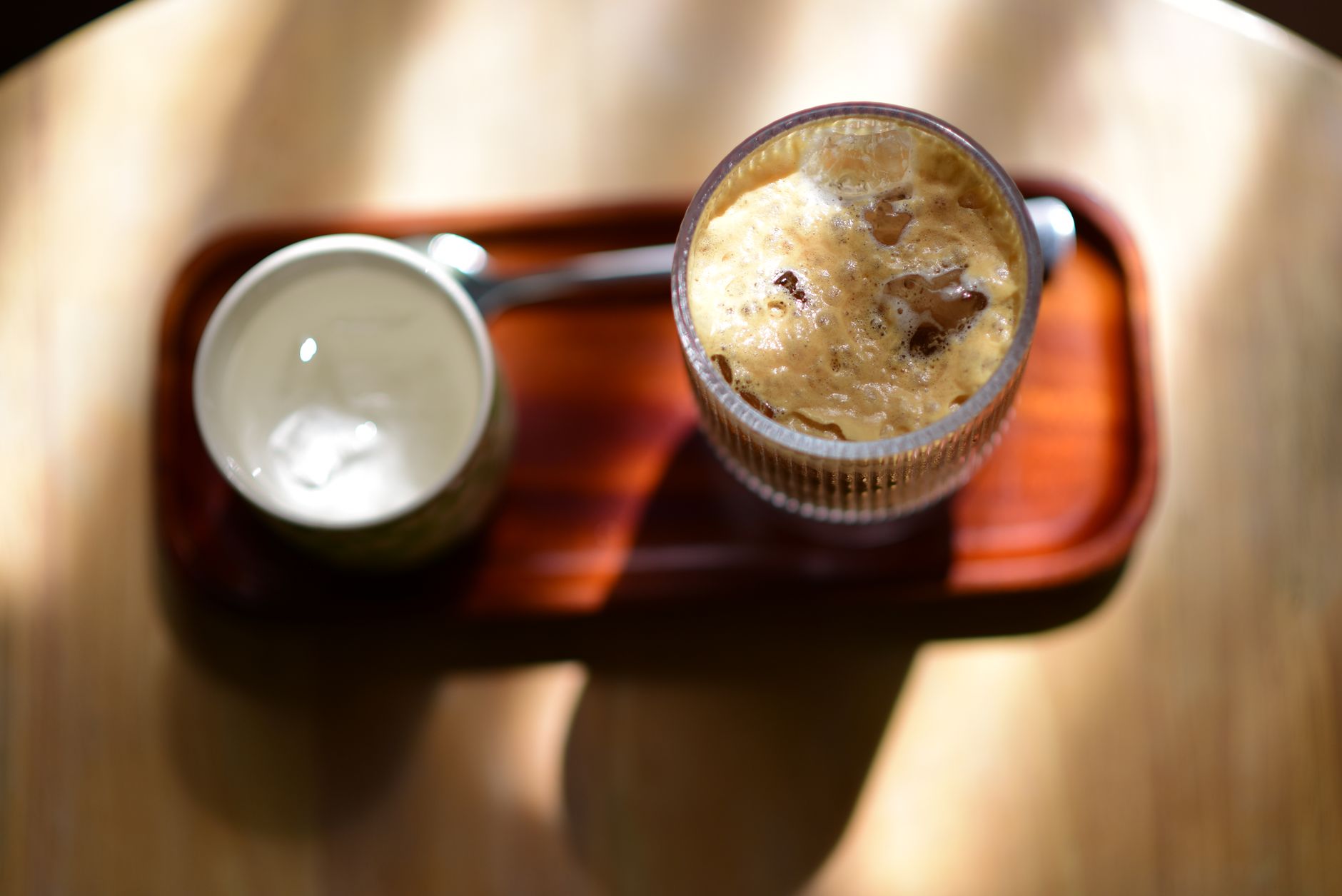 iced dalgona coffee oat milk glass overhead view