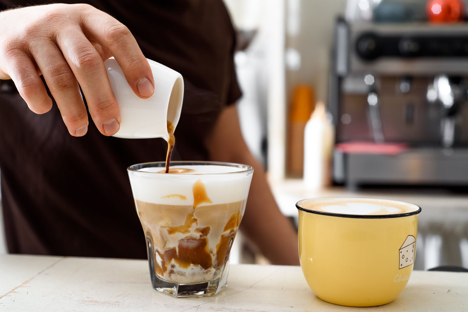 espresso shot pouring over tonic water ice glass