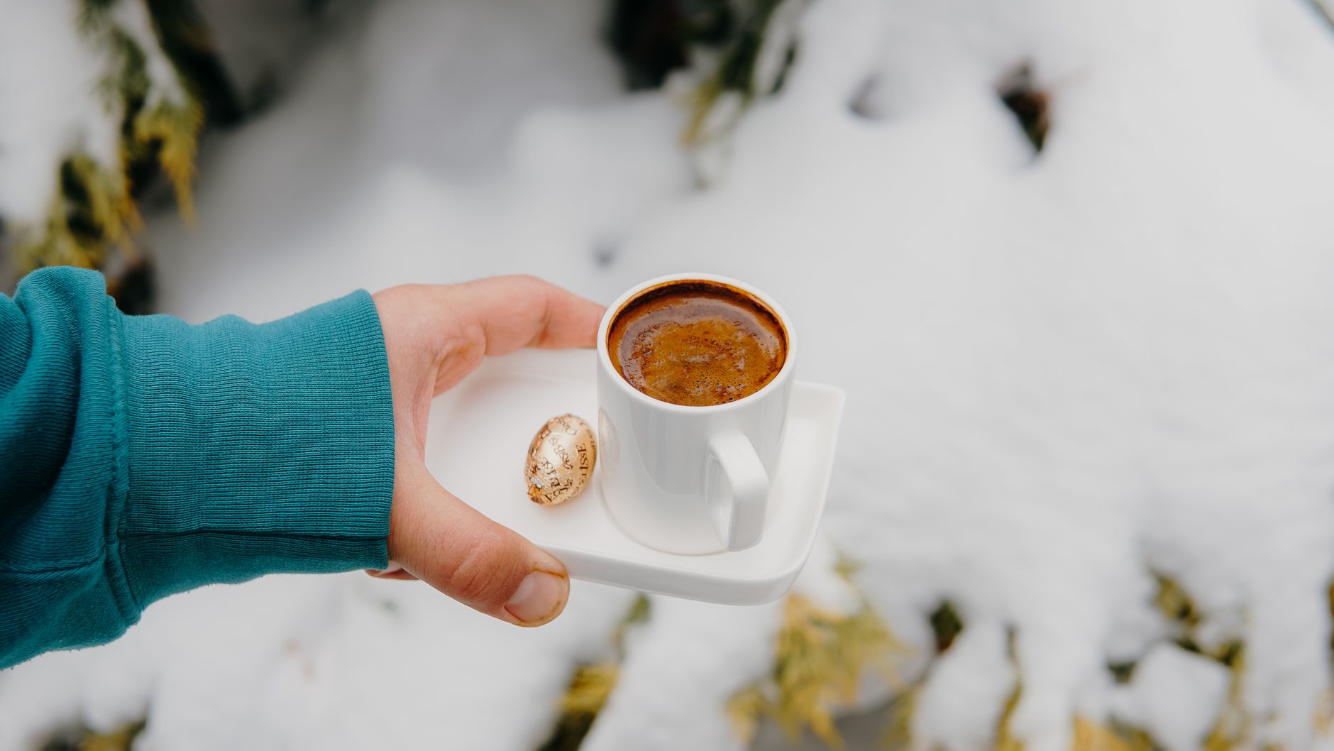 espresso shot golden crema in white ceramic cup