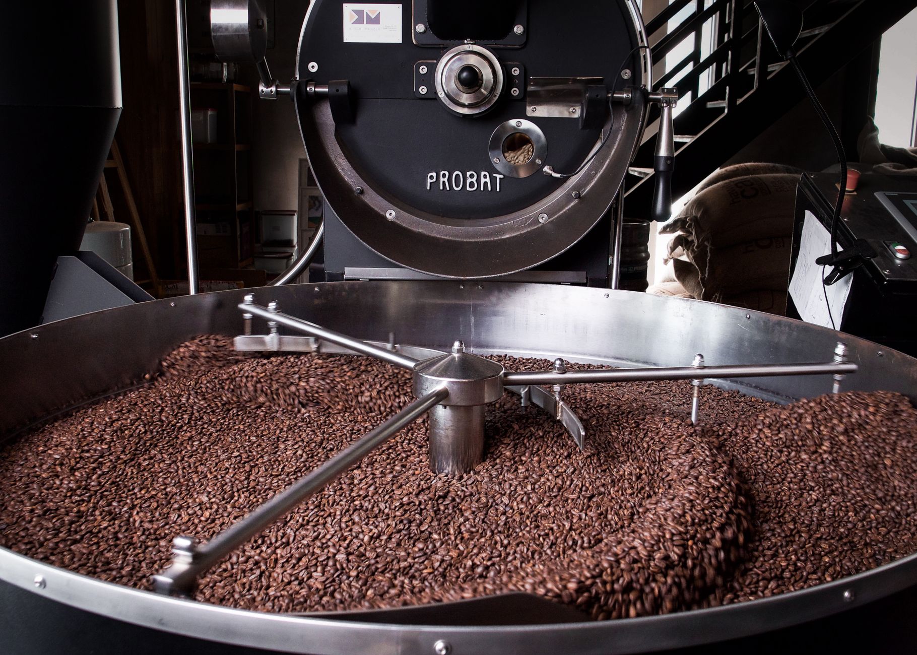 green coffee beans burlap sack warehouse