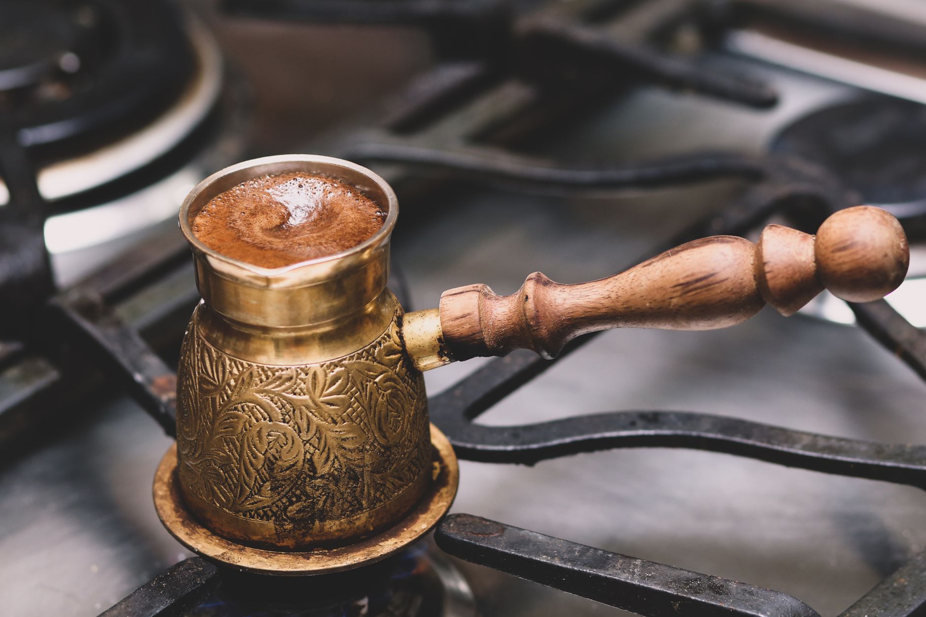 coffee maker carafe filled with white vinegar water solution