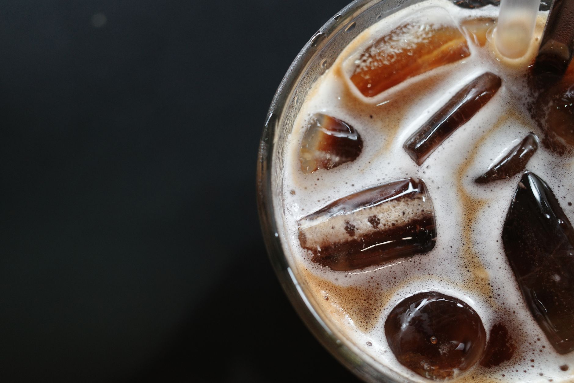 iced espresso crema dissolving cold glass