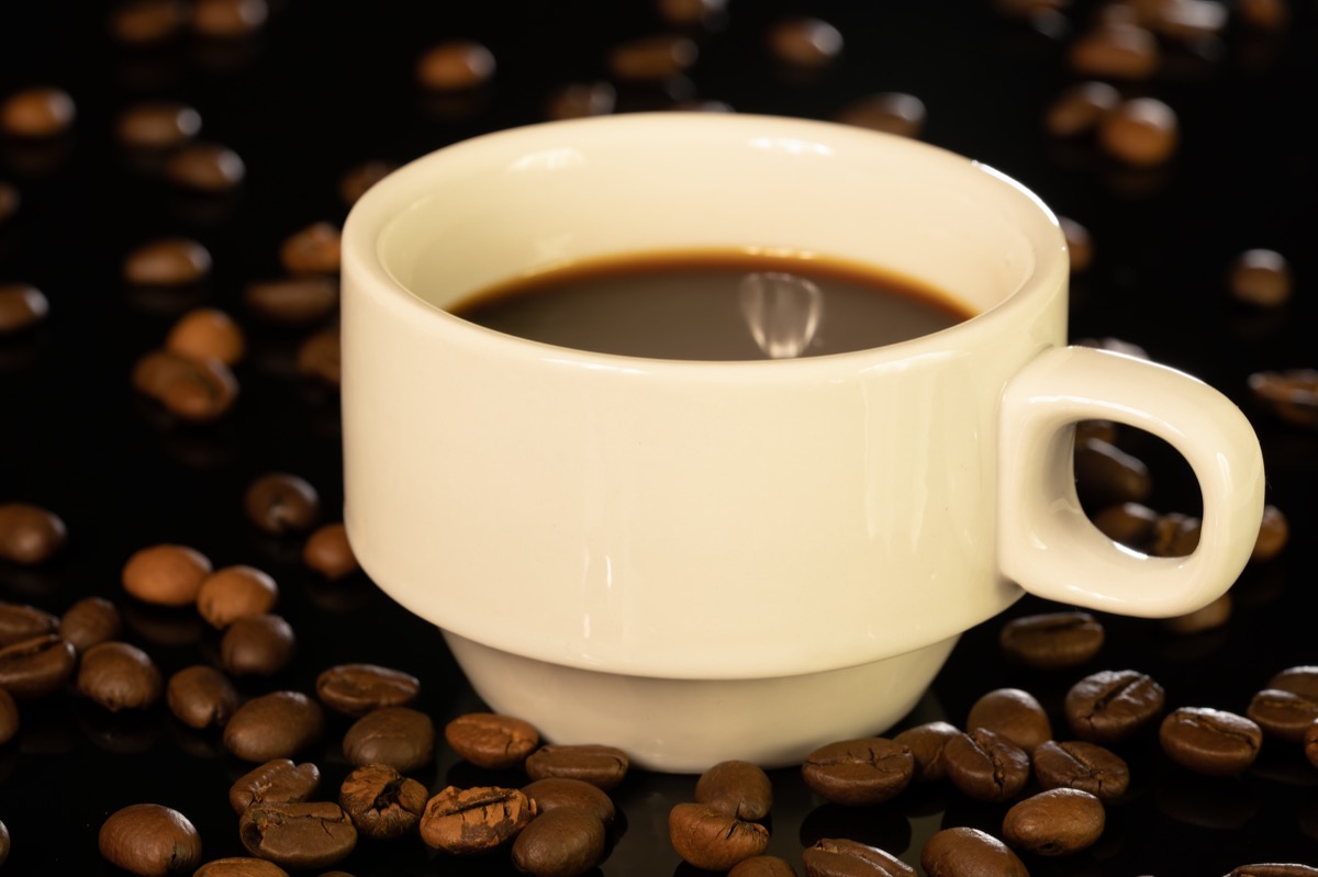 espresso shot with thick golden crema in white ceramic cup
