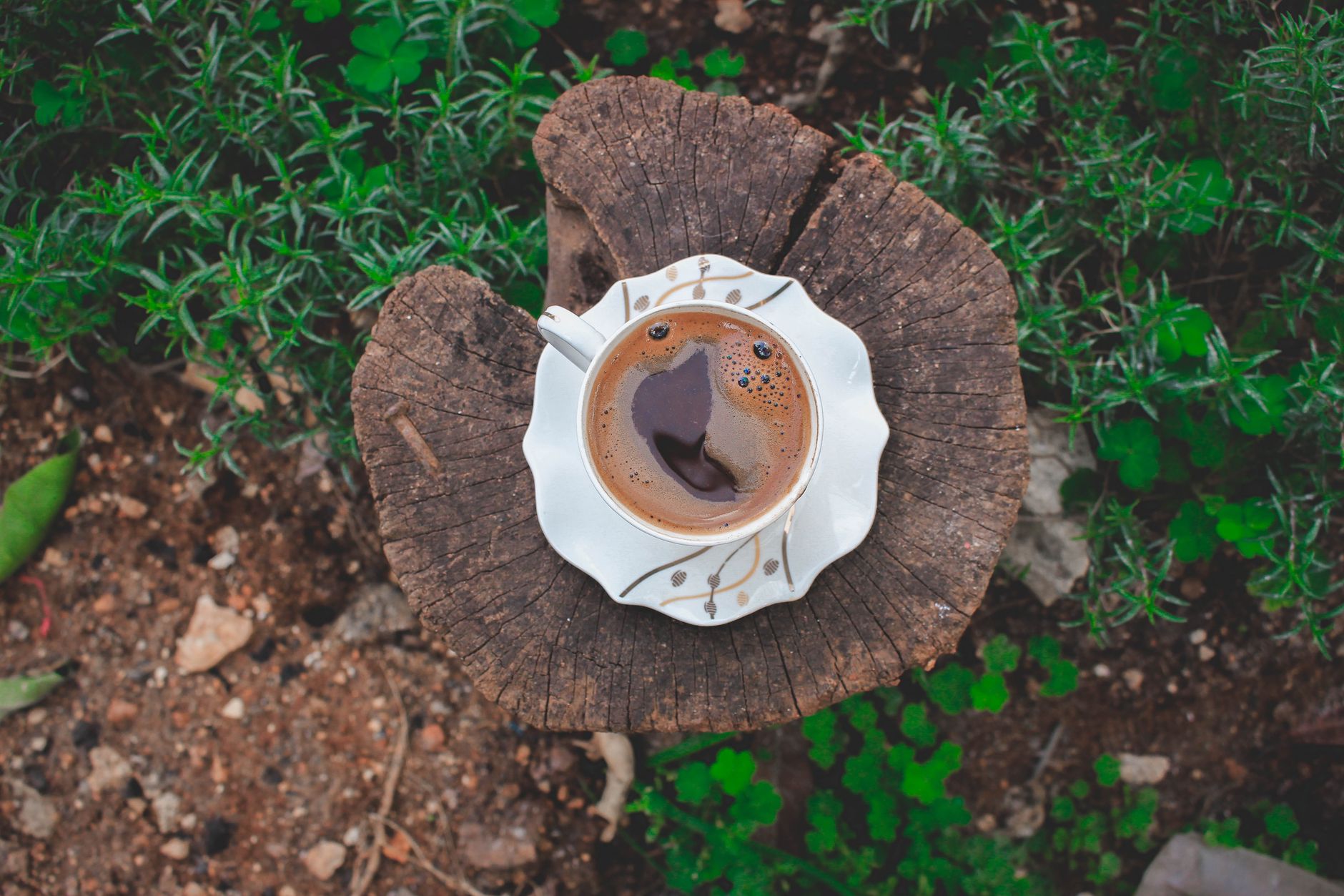 turkish coffee grounds foam pouring demitasse