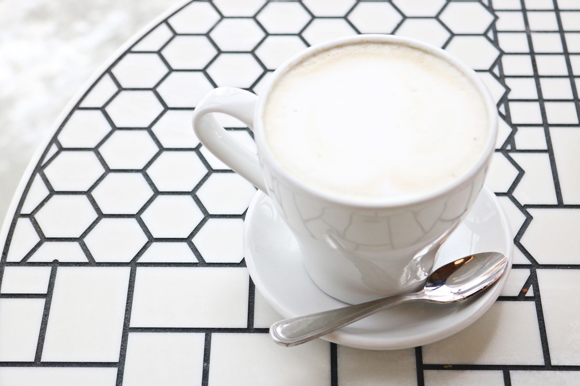 latte art pouring espresso oat milk tulip