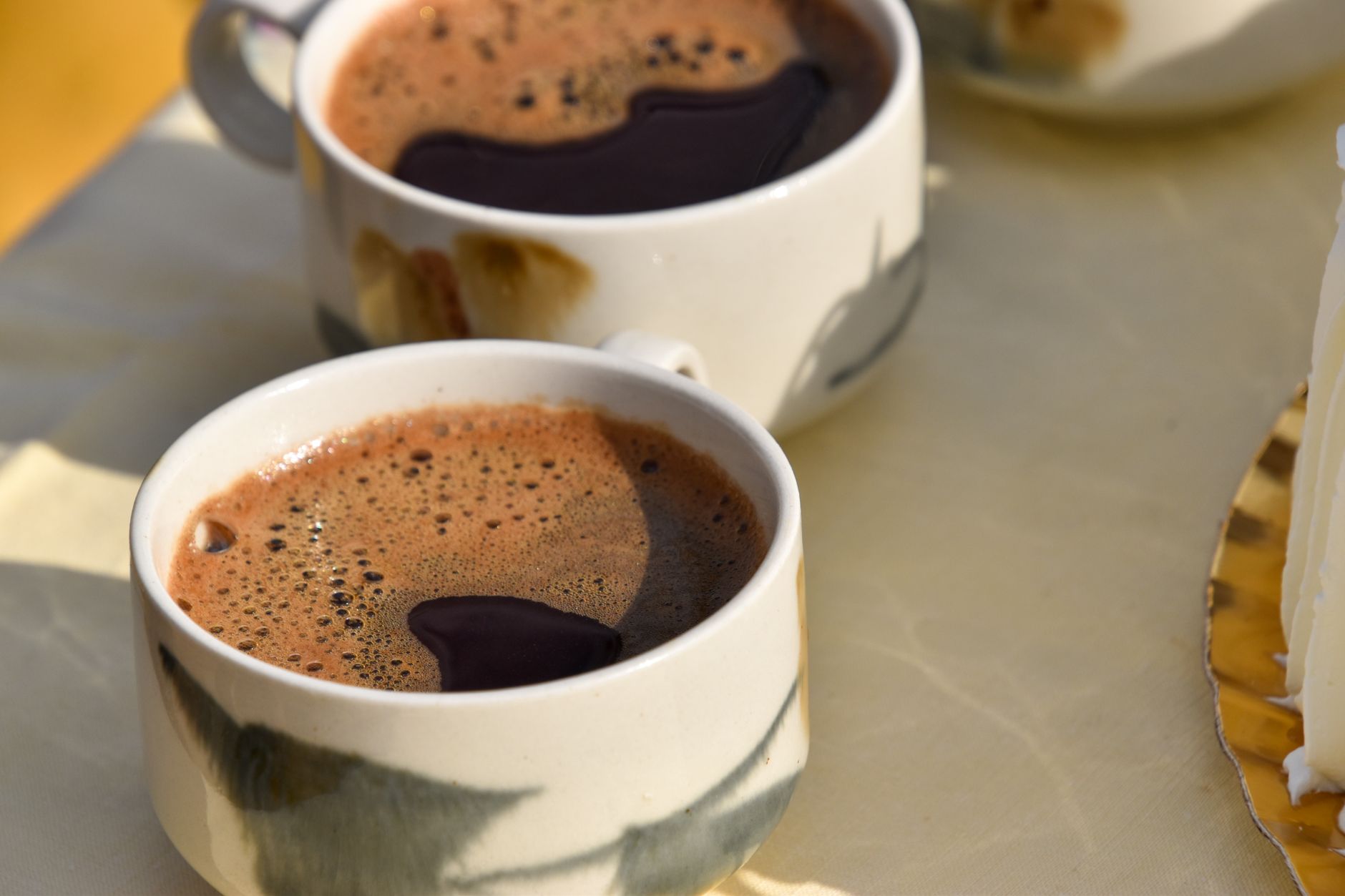 nespresso capsule crema foam close-up comparison