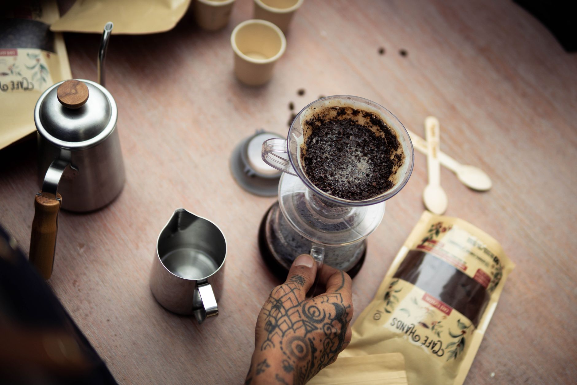 specialty coffee pour over brew black cup wooden table