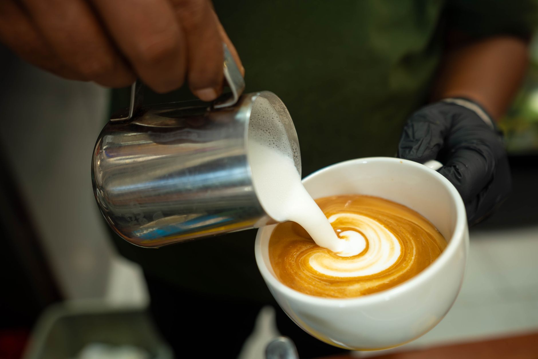 milk steaming wand latte microfoam close-up