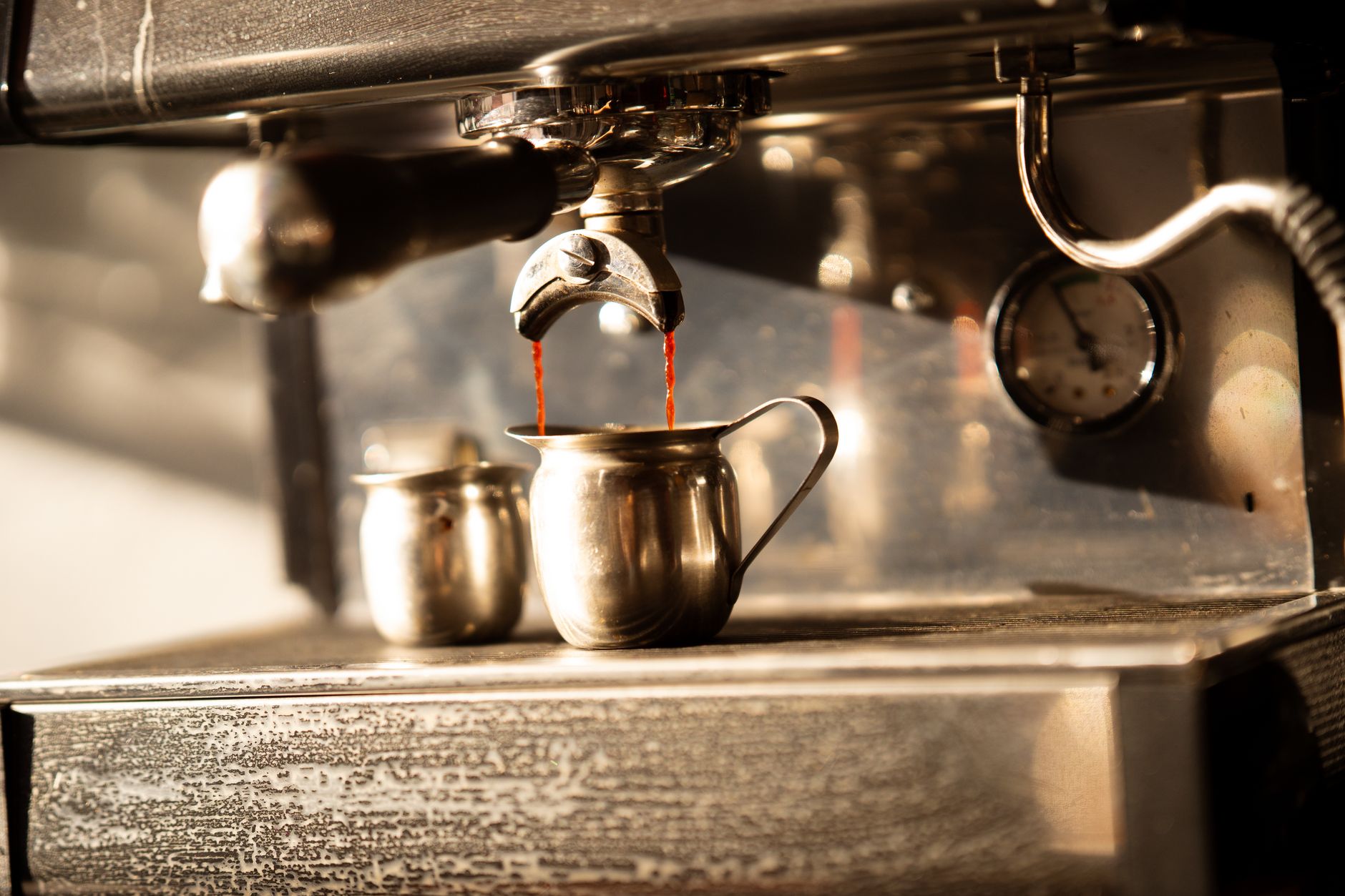 steam wand microfoam milk pitcher close-up