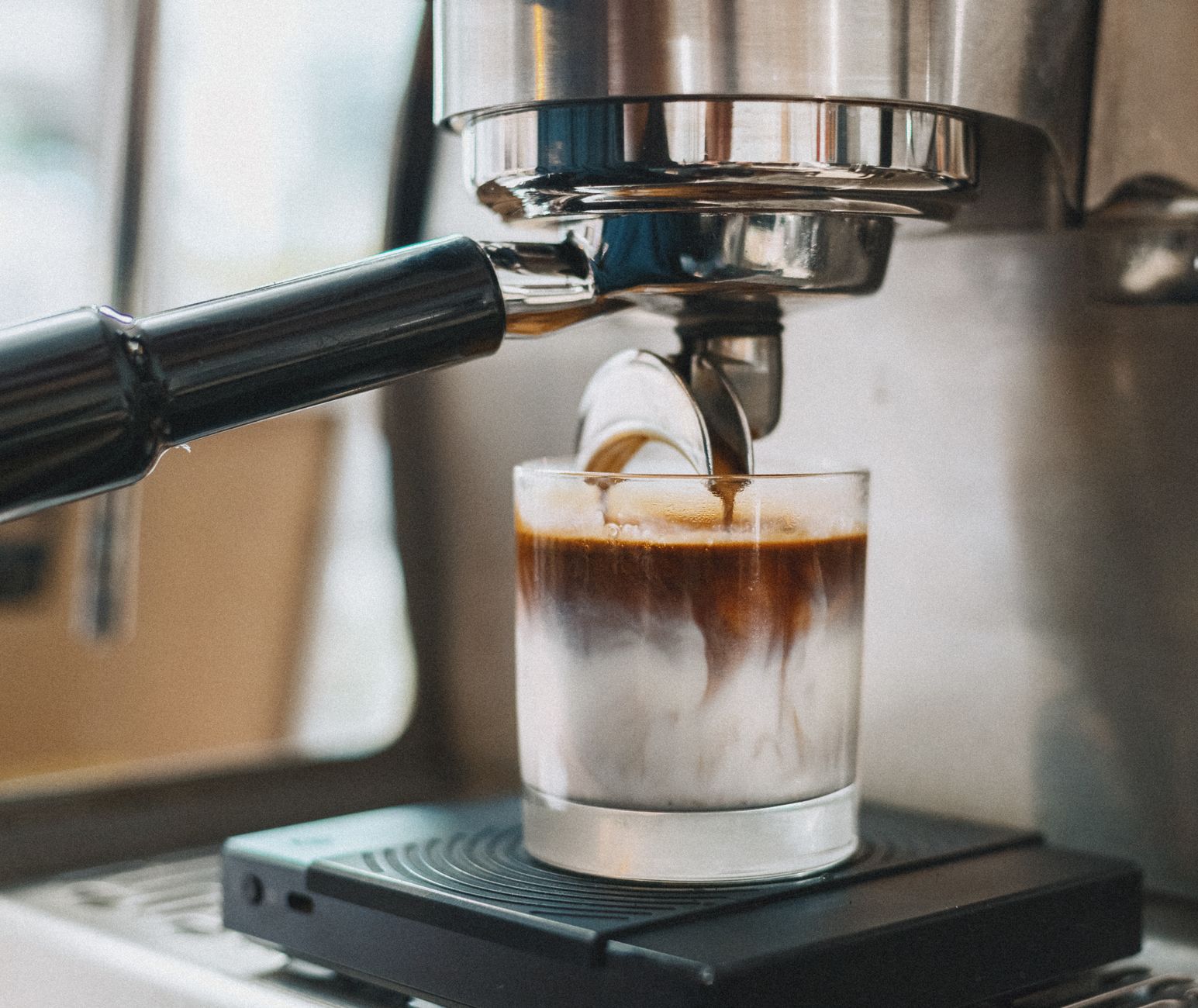 espresso shot golden crema lever pull close-up