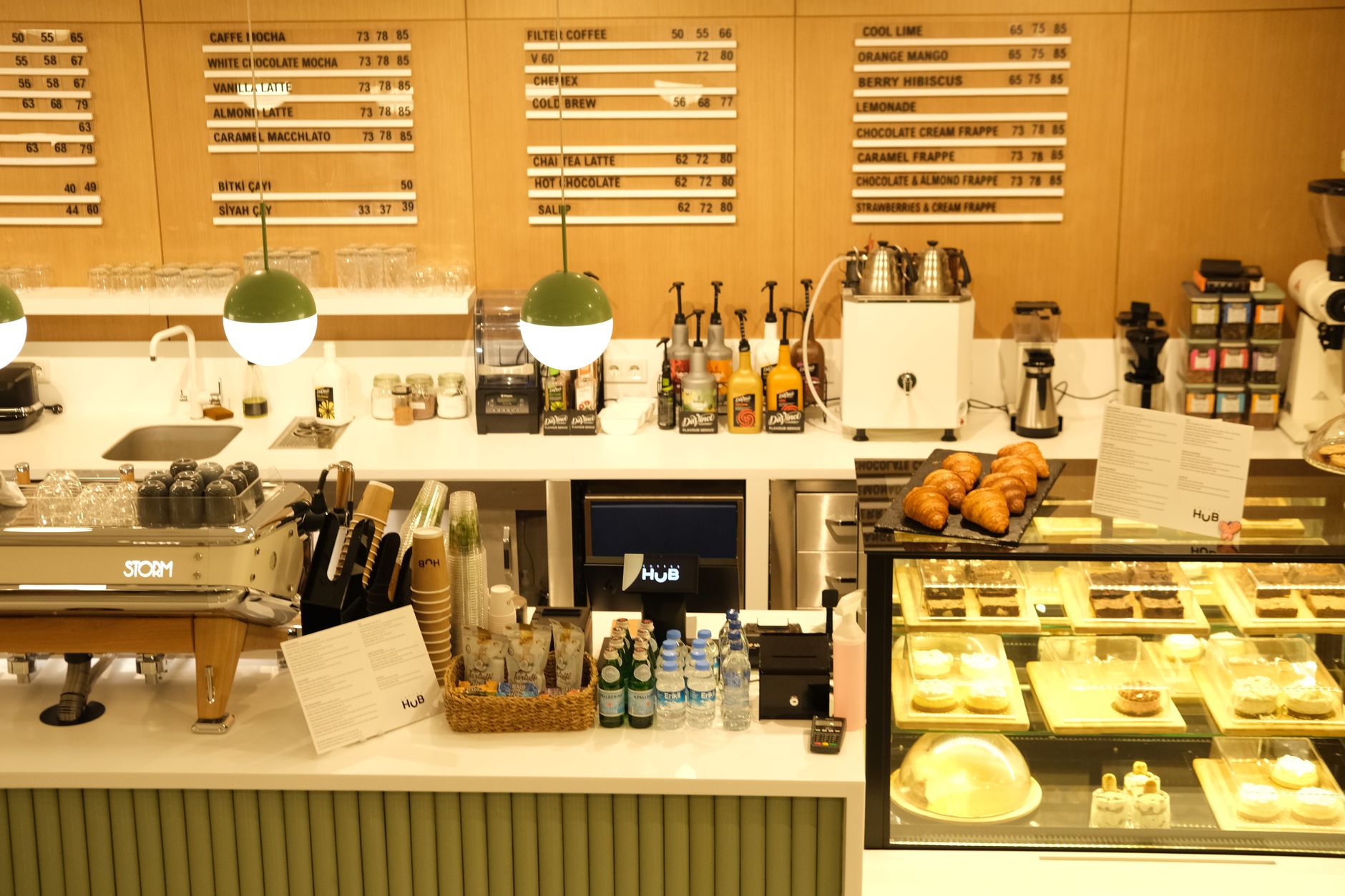 monin torani syrup bottles side by side espresso bar