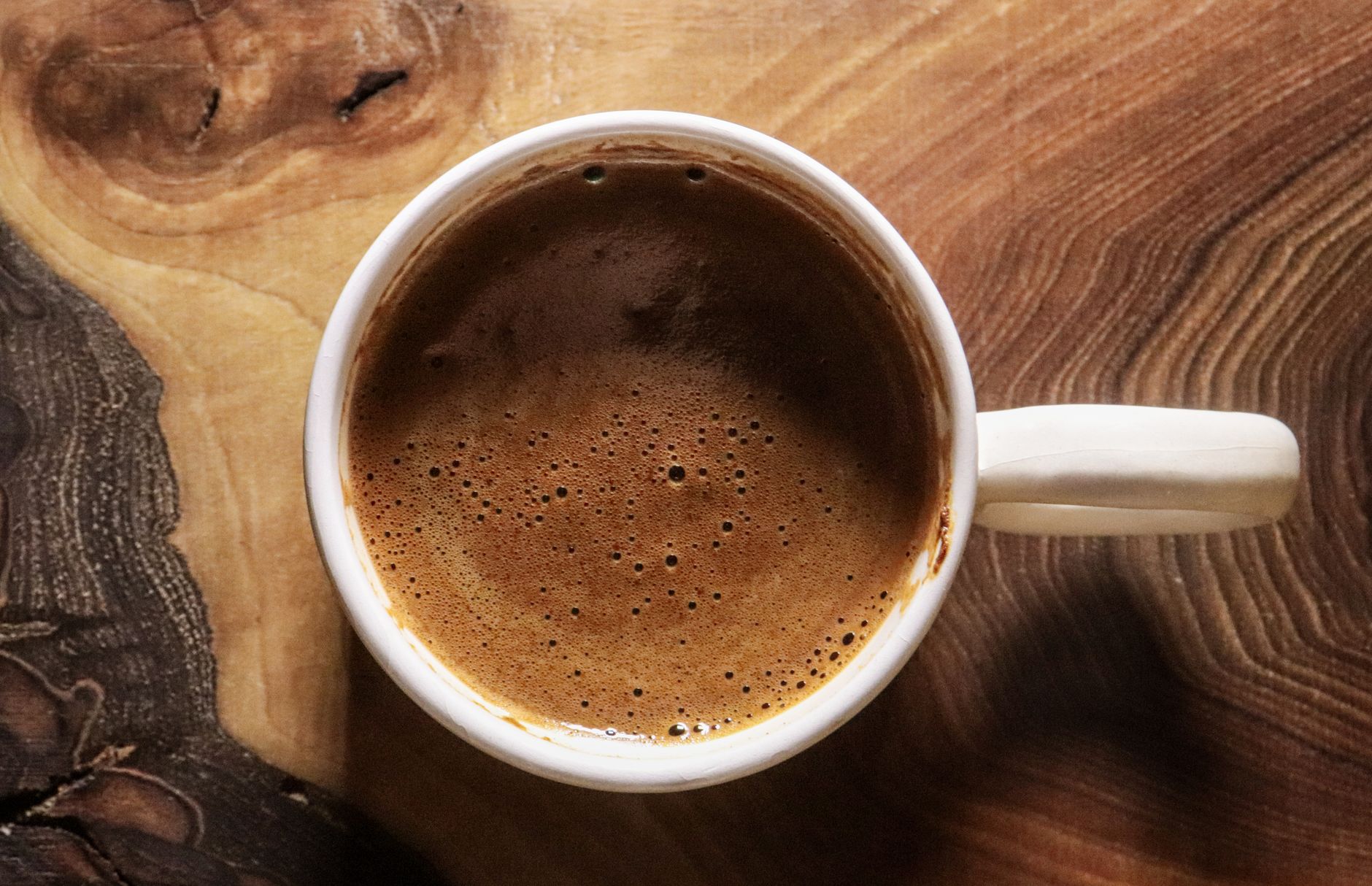 nespresso vertuo espresso shot with golden crema in ceramic cup