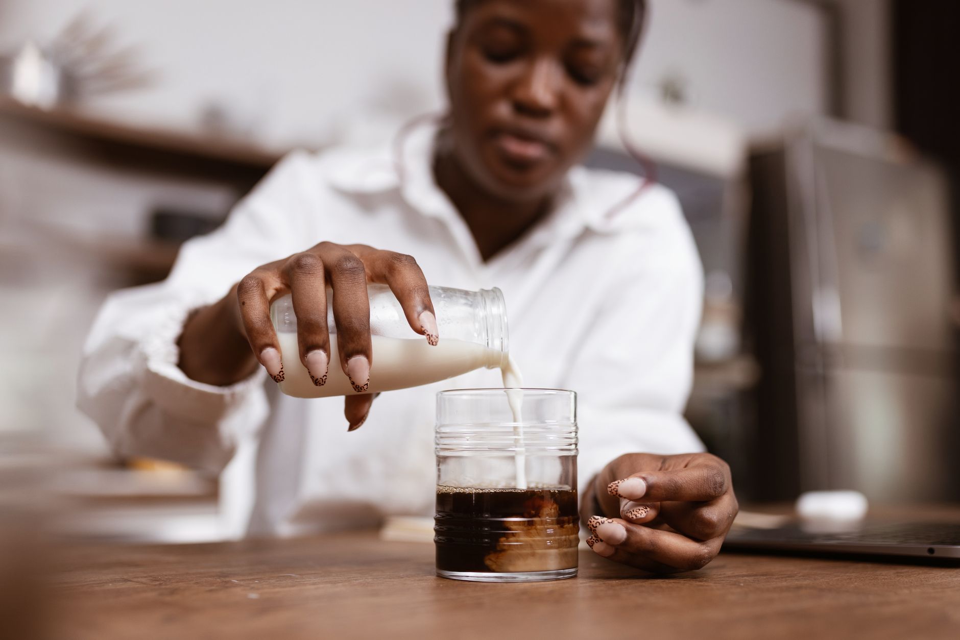 iced oat milk latte glass espresso layered
