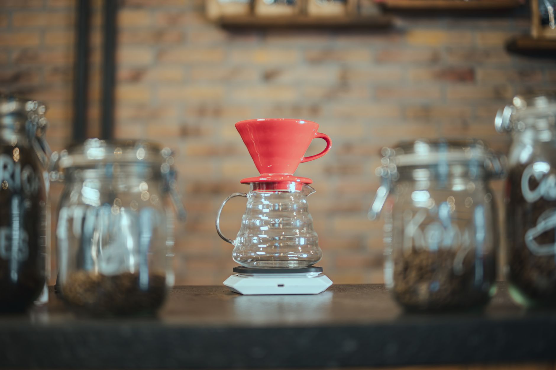 hario v60 ceramic red brewing over glass carafe